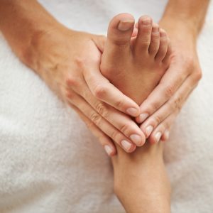 Cropped shot of a womans foot being massaged.