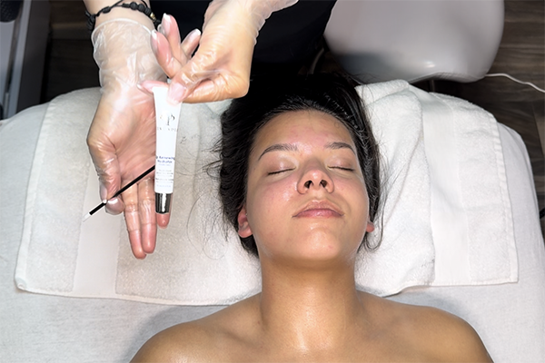 teen girl receiving best facial massage and lymphatic drainage